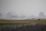 First responders tend to the scene of a reported plane crash at a regional airport in Statesville, N.C., Thursday, Dec. 18, 2025.