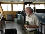 Essayons Capt. James Holcroft oversees the bridge of the dredge.