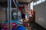 Lusina Oliver, left, and colleague Karen McCarthy load donated supplies into a trailer for evacuees of the Bench Fire at McCarthy’s garden store, Madras Garden Depot, in Madras, Ore., July 28, 2026. McCarthy posted a donation drive on a local Facebook page and says the response was overwhelming.