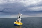In this 2018 image provided by Woods Hole Oceanographic Institution, a buoy used to gather data floats in the Pioneer Mid-Atlantic Bight off the coast of North Carolina.
