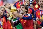 Spain's Ferran Torres celebrates with the trophy after winning the World Cup final soccer match between Spain and Argentina in East Rutherford, N.J., near New York, Sunday, July 19, 2026.