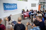 U.S. citizens who are members of the group Democrats Abroad gather to drop off their ballots for the 2020 presidential election into a box provided by the U.S. embassy in Bangkok in 2020.