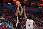 Florida State forward Cam Corhen (3), shoots over Louisville forward Roosevelt Wheeler (4) during the first half of an NCAA college basketball game in Louisville, Ky., Saturday, Feb. 4, 2023.