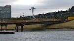 Rather than used diesel-burning trucks to haul contamined soil offsite, Zidell recycled 250 truckloads of the material by using it as fill dirt under the concrete seals of the Tri-Met station under construction next to the Zidell property.