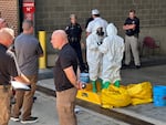 A hazmat crew from the National Guard's Civilian Support Team investigates after a suspicious package was delivered to election officials at the Missouri Secretary of State's Jefferson City, Mo., office on Tuesday.