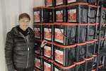 Depoe Bay Mayor Kathy Short checks the community's emergency supplies in a shipping container that is located in the city hall's parking lot.