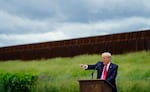 Former President Donald Trump speaks during a visit to an unfinished section of border wall with Texas Gov. Greg Abbott, in Pharr, Texas, Wednesday, June 30, 2021.