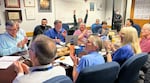 Members of the Voyager team celebrate at NASA's Jet Propulsion Laboratory after receiving data about the health and status of Voyager 1 for the first time in months.
