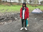 "They call me 'Moth' out here," says a young man with a skateboard traveling near Delta Park in North Portland on March 23, 2022. He was with his fiancée, Amber Watier.