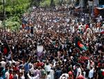 People participate in a rally against Prime Minister Sheikh Hasina and her government in Dhaka, Bangladesh on Sunday.
