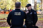 Portland police Lt. Jeff Niiya, right, with the police bureau's rapid response team at a protest in downtown Portland, Ore., Saturday, Nov. 17, 2018., 2018.