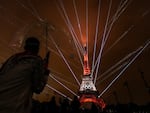 A light show is displayed on the Eiffel Tower during the opening ceremony of the 2024 Summer Olympics, Friday, July 26.