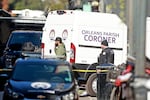 The Orleans Parish Coroner van returns to the scene on Bourbon Street after at least ten people were killed when a person allegedly drove into the crowd.