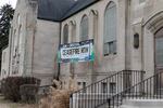 Congregation T'chiyah & the First United Methodist Church flies a banner calling for a ceasefire in Ferndale, Mich.