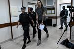 Women's National Basketball Association player Brittney Griner leaves the courtroom after the verdict in Khimki, outside Moscow, on Aug. 4. A Russian court found Griner guilty of smuggling and storing narcotics.