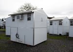 Two pallet homes seen on Nov. 20, 2025, that previously housed Sandbox residents now sit empty after the site lost state funding.