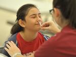 A fifth-grader receives the FluMist influenza virus vaccine in Anaheim, Calif., in 2015.