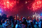 Spectators watch as fireworks are launched over the East River and the Empire State Building in New York City on July 4, 2021. Regulators are warning people ahead of July Fourth to be careful handling any recreational fireworks.