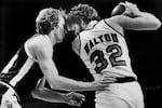 FILE: Denver Nuggets' Dan Issel, left, guards Portland Trail Blazers' Bill Walton as Walton moves towards the basket during their game in Portland, Ore., Feb. 12, 1978. Walton, who starred for John Wooden's UCLA Bruins before becoming a Basketball Hall of Famer and one of the biggest stars of basketball broadcasting, died Monday, May 27, 2024, the league announced on behalf of his family. He was 71.
