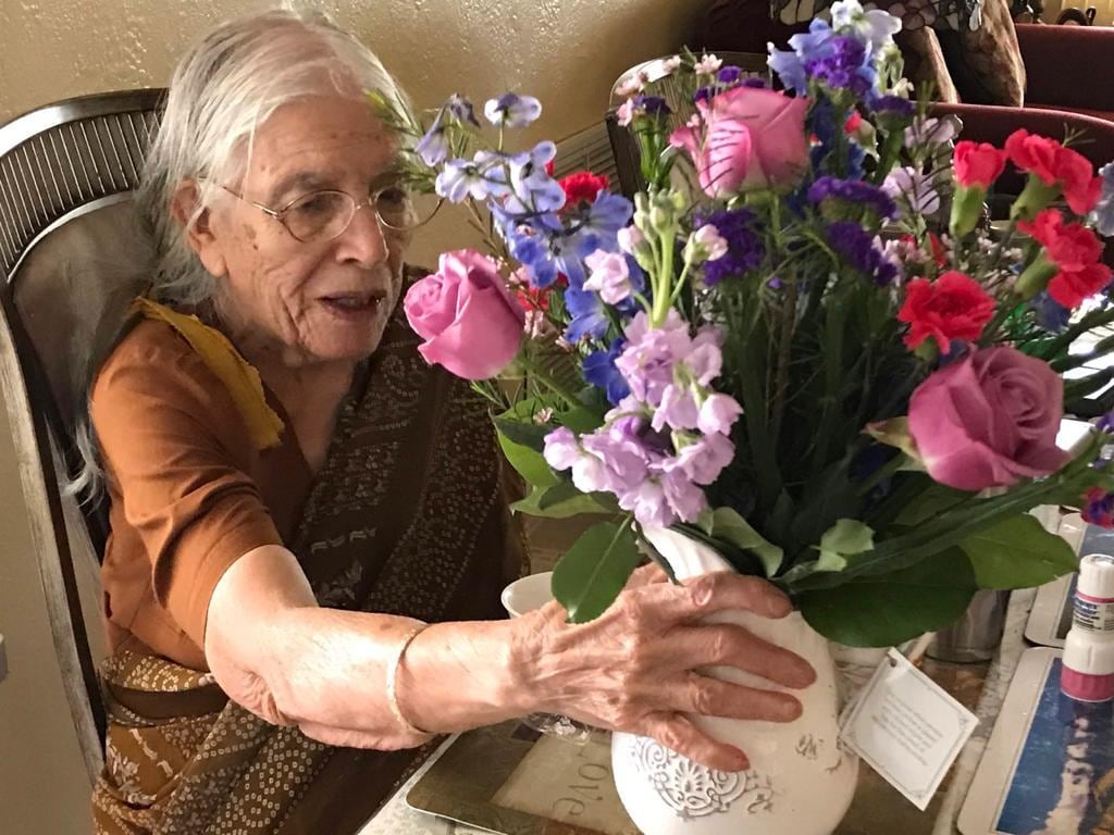 Subhan Ali's mother, Syeda Ali, receiving flowers on her birthday in 2017.