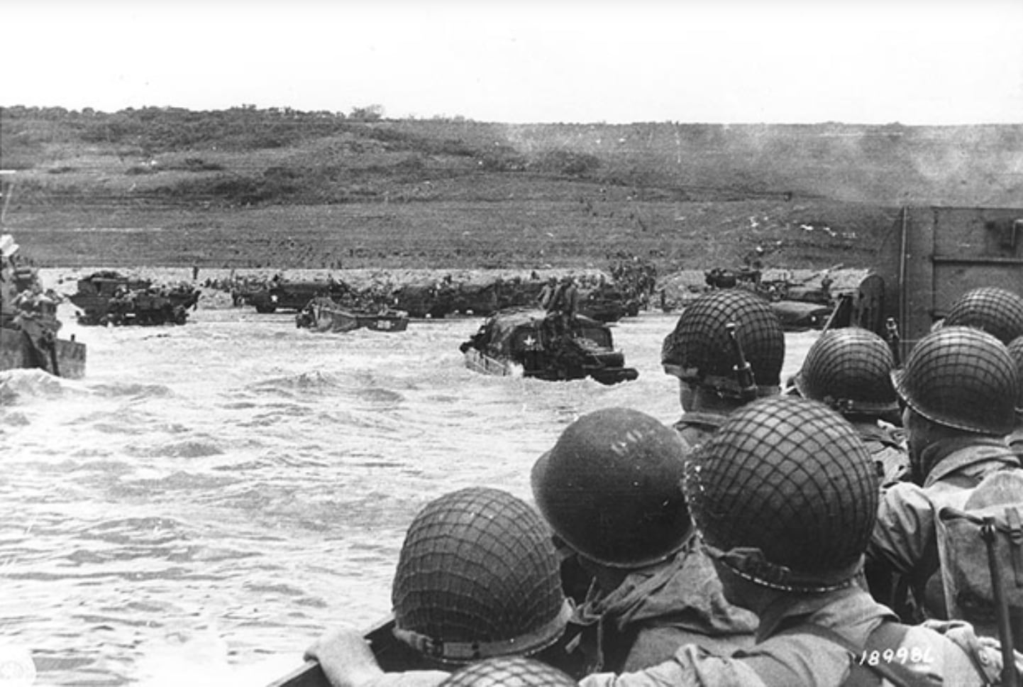 Soldiers crowd a landing craft on their way to Omaha Beach during the Allied Invasion of Europe,