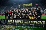 The Portland Thorns pose with the trophy after the team won the National Women's Soccer League championship match against the Kansas City Current on Saturday in Washington, D.C. Portland won 2-0.