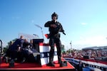 Republican presidential candidate former President Donald Trump is surrounded by U.S. Secret Service agents on stage at a campaign rally, Saturday, July 13, 2024, in Butler, Pa.