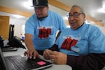 Scott Kalama helps Louie Pitt fill out a census form online in Warm Springs, March 12, 2020. 