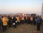 Fire personel at a morning briefing on Aug. 8, 2017. 