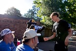 Incoming freshman Rylan Nelson receives a school pennant and keys as he moves into the dorms at George Fox University in Newberg, Ore., Aug. 22, 2025. The university is looking at another record high enrollment for the 2025-2026 school year, living up to their title as the largest private university in Oregon. 