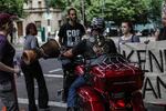 One motorcycle rider attempted to ride through the crowd but was quickly stopped.