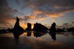 Winter sunset at Face Rock State Scenic Viewpoint, an image shown as part of an Oregon Historical Society exhibit on the history of Oregon State Parks.