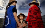 Darkfeather Ancheta, left, with her nephew, Eckos Chartraw-Ancheta, and sister, Bibiana Ancheta, on the shore of Tulalip Bay. Seattle photographer Matika Wilbur captured images of 562 federally recognized tribes for her book "Project 562."