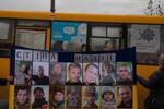 A banner under the title “Wall of Hope” shows the faces of missing relatives and prisoners of war captured by Russia during a demonstration in the mining town of Ternivka, Ukraine, on Oct. 20. Many male coal miners have been conscripted into military service as Ukraine continues to battle against Russia’s invasion of the country.