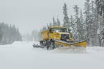 A wing plow clears heavy snow Tuesday, Jan. 9, 2024, in this photo by the Oregon Department of Transportation. Gov. Tina Kotek said snow clearing is one of the services aided by a new transportation funding package.