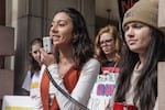 Catlin Gabel sophomore Helena Khoury (left) speaks to students while Lincoln junior Faith Pauken (right) looks on.