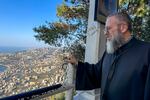 Father Fadi el-Mir looks out to the Mediterranean from Our Lady of Lebanon sanctuary. Pope Leo will meet there with clergy and other church officials. The priest says he prays the pope will inspire the church to be more responsive to the needs of Lebanese people going through difficult times.