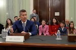 With his family sitting behind him, former Wisconsin Rep. Sean Duffy, R-Wis., testifies before the Senate Commerce, Science, and Transportation Committee on Capitol Hill in Washington, Wednesday, Jan. 15, 2025, for his nomination to be Transportation Secretary. (AP Photo/Susan Walsh)