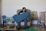 Caitlyn Martin sits with an infant in a cradle board at The Children's Learning Center at Central Oregon Community College in Madras, Ore., on June 4, 2026.