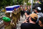 Israeli soldiers carry the casket Israeli Staff Sgt. David Sasson as mourners gather during his funeral in Netanya, Israel, on Thursday, March 7.