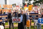 Sen. Jeff Merkley, D-Ore., speaks to demonstrators at Thursday's event. His efforts to block federal funding for the arch were rejected by a GOP senator earlier in the week.