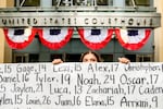 Olivia Konar holds a banner with names of young people who advocates say died as a result of social media outside the Ronald V. Dellums Federal Building and U.S. Courthouse on Tuesday, Aug. 18, 2026, in Oakland, Calif. Her sister Coco Konar died in 2022 when she was 17. Social media company Meta agreed to a nearly $17 billion settlement with a group of states over its child safety practices.