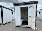 The entrance of one of 140 planned sleeping pods erected at the Clinton Triangle Temporary Alternative Shelter Site displayed during a July 17, 2023 tour.