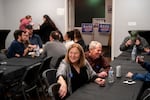 Incumbent Vancouver Mayor Anne McEnerny-Ogle enjoys a performance while talking with attendees at her election night party at the Fire Union Hall in Vancouver, Wash., on Nov. 4, 2025.