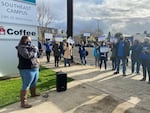 Laura Wadlin, PCCFFAP secretary, speaks to a crowd of employees and supporters at the informational picket on Wednesday, Dec. 8, 2021.