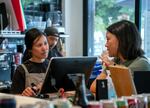 Natalie Truong, co-owner of Hapa Pizza in Beaverton, Ore., speaks with a customer, Aug. 9, 2024. “We've gotten a lot of people – to the point where I'm almost in tears because they're so encouraging – telling us to stick with it and keep doing what we're doing,” she says.