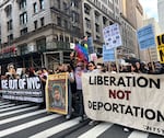Thousands of people marched throughout the streets of Manhattan Tuesday night as part of a series of nationwide rallies against President Trump’s immigration sweeps and the deployment of the U.S. military in California.