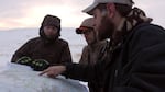 Tyler Houck (right) shows two hunters where elk were last sited, as well as pointing out the Nature Conservancy's borders, so they don't stray onto neighboring private land without permission.