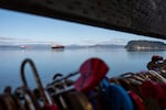 Heart-shaped padlocks, part of the Love Locks project, cover railing on Pier 39 as ships navigate the mouth of the Columbia River in Astoria, Ore., on Feb. 12, 2026.