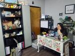 Ashliegh Ramirez sits in her office lined with shelves containing client rewards in the basement of Phoenix Wellness Center in Newport, Ore., on March 28, 2022